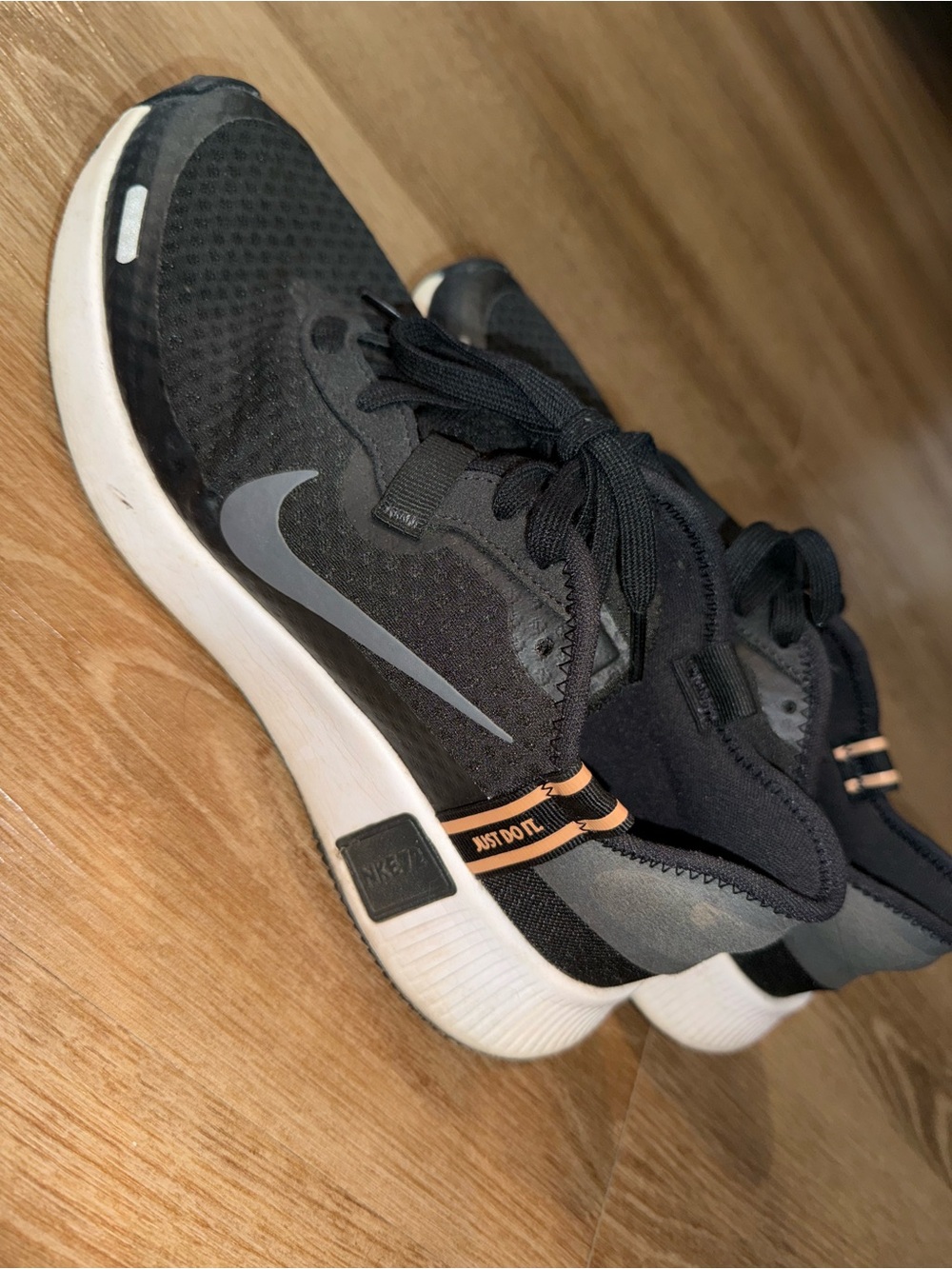 Women’s 9 Nike Black / Gold running sneakers